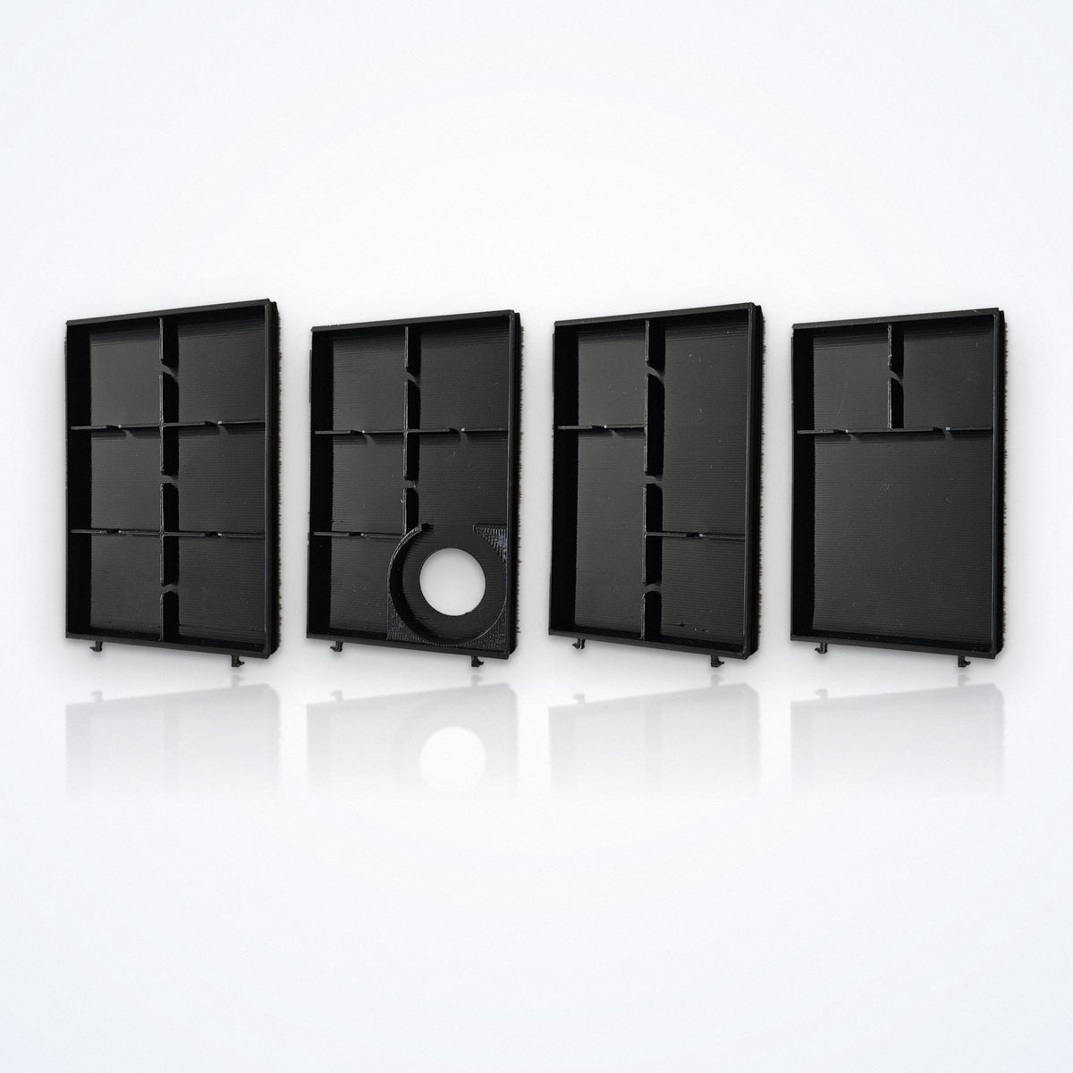 Vier leere WalletCase-Module nebeneinander – Festplatz A6, Tracker-Festplatz T-A5, B4 und A3